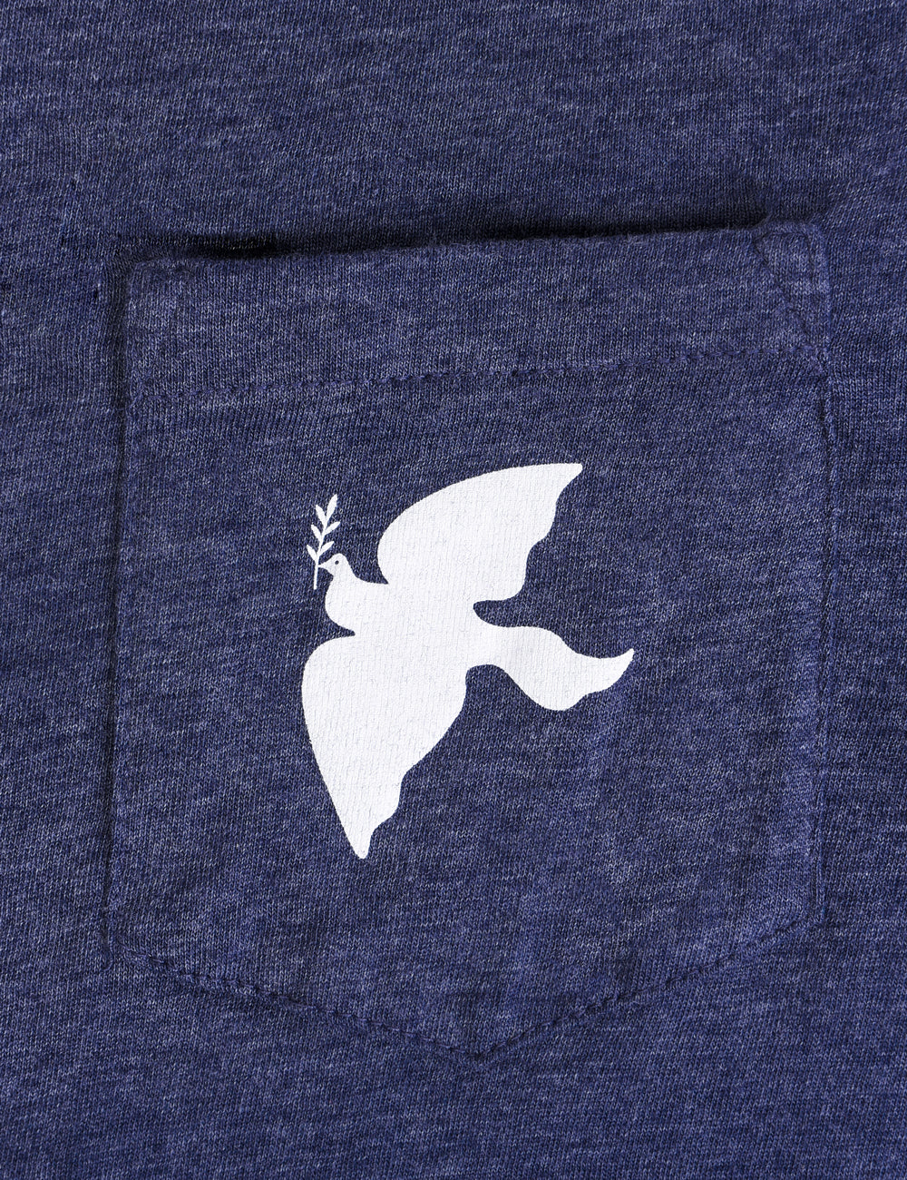 Close-up shot of the dove pocket on the t-shirt.