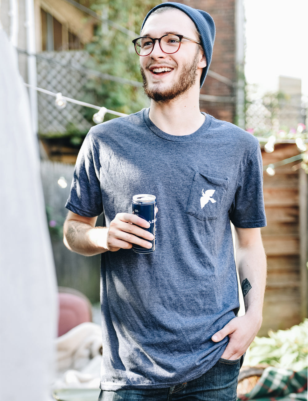 Image of someone wearing a Dove Pocket T-Shirt.